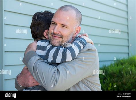 Father and son hugging Stock Photo - Alamy