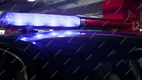 Premium Photo | Closeup blue and red lights flashing on police car ...