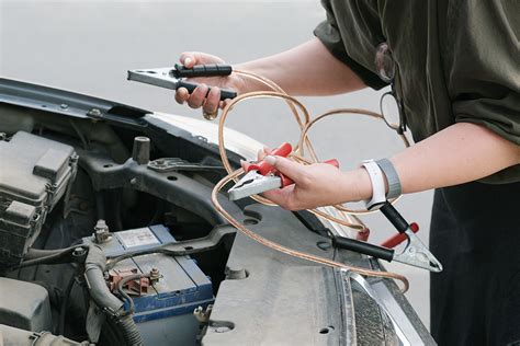 How to Charge a Dead Car Battery Using Jumper Cables - Zore’s Towing ...