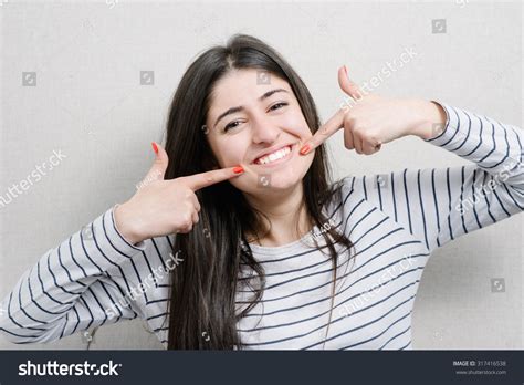 Pretty Girl Pointing Finger On Her Stock Photo 317416538 | Shutterstock