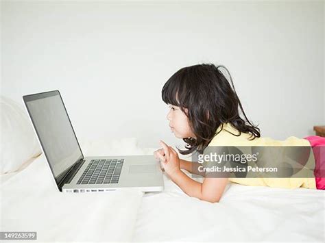 Girl Lying Down Laptop Photos and Premium High Res Pictures - Getty Images