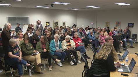 Manitowoc residents pack school board meeting over decision to end free ...