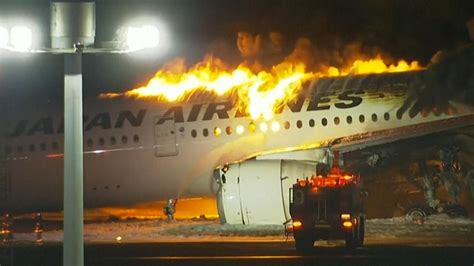 Japan plane fire latest: Hundreds survive plane collision inferno ...