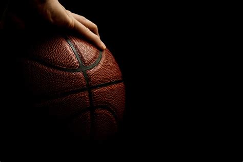 Mans Hand Palming Basketball Isolated On Black Background Room For Text ...