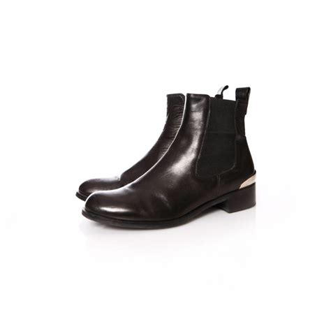 Russell & Bromley, black leather chelsea boots with silver metal on the ...