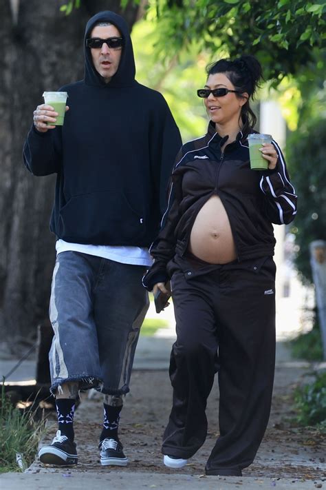 Pregnant Kourtney Kardashian shows off baby bump in tracksuit with ...