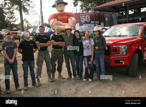 U.S. Marines, from Recruiting Station Baton Rouge, take a photo with ...