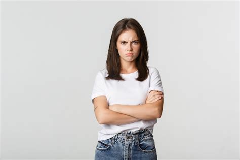 Free Photo | Angry sulking girl cross arms and frowning, feeling offended.