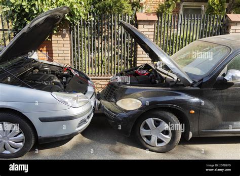 Recharging a car battery from a car. The car battery has run out Stock ...