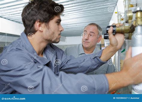 Portrait Plumber with Apprentice Stock Image - Image of apprenticeship ...