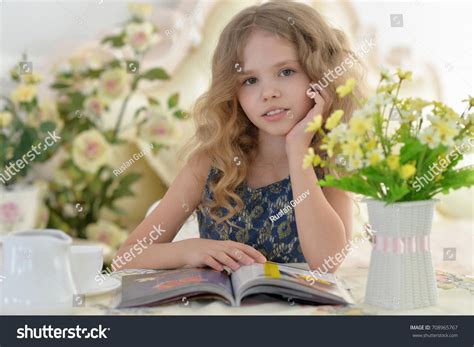 Little Girl Reading Magazine Stock Photo 708965767 | Shutterstock