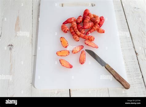 oca tubers being prepared for cooking in a kitchen Stock Photo - Alamy