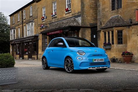 a blue car parked in front of a building