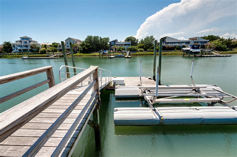 Private boat dock has plenty of room for boats, kayaks, wave runners ...