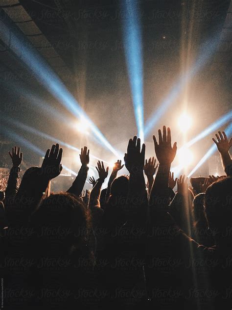 "Hands Raised At Live Concert" by Stocksy Contributor "Branden Harvey ...