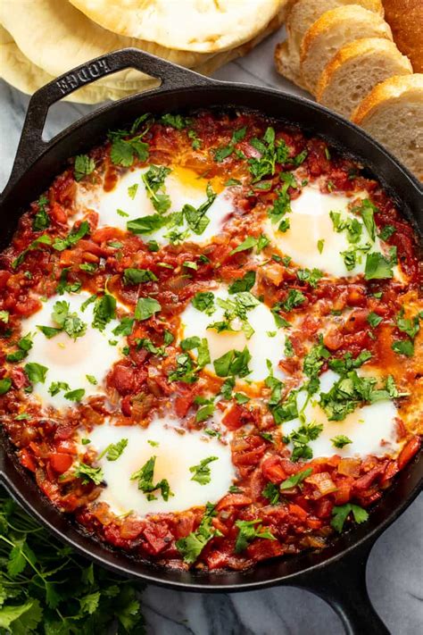 Shakshuka is a classic Middle Eastern dish where eggs are poached in a ...