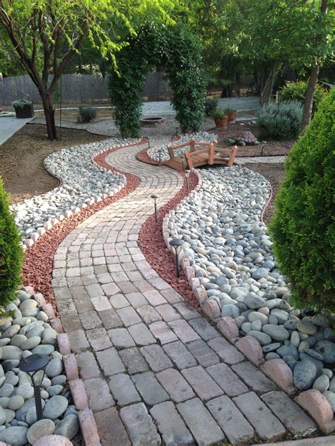 Added rock to our brick walkway | Backyard landscaping, Porch ...