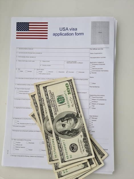 Premium Photo | American visa application form and cash american banknotes