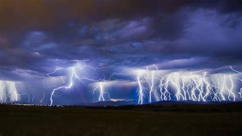 Canberra weather: Storm lights up capital but hot days still ahead