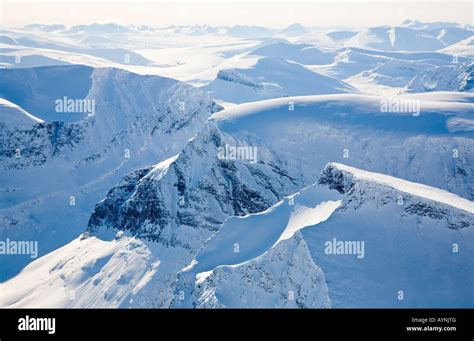 Aerial view over the Scandinavian Mountains, in front the Tolpagorni ...