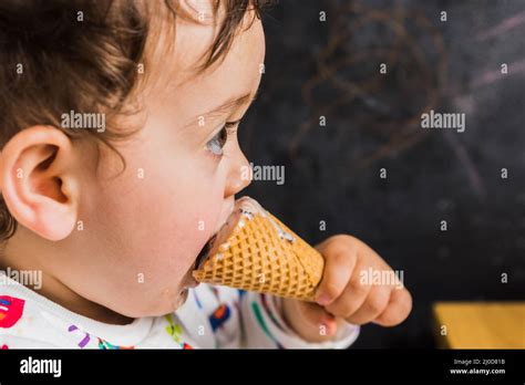 A baby eating a ice cream Stock Photo - Alamy