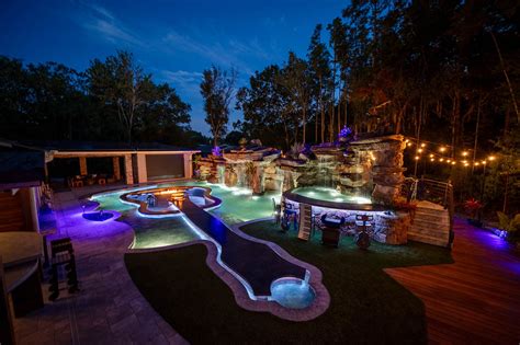 This Guitar Shaped Pool Features a Rock Waterfall and Swim-up Bar - Mad ...