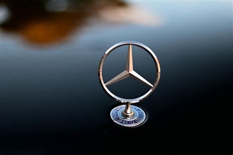 Silver Mercedes Benz Logo on Black Surface · Free Stock Photo