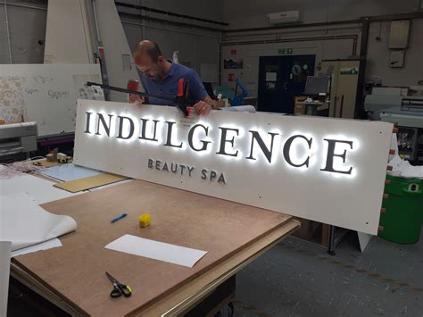 LED illuminated sign in the workshop Shop Signage, Retail Signage ...