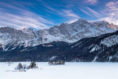 Frozen Lake Eibsee Below Zugspitze Mountain in Winter Stock Photo ...