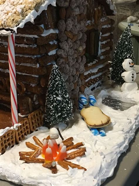 a close up of a gingerbread house on a table