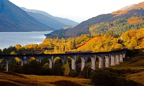 A train crosses Glenfinnan viaduct with Loch Shiel in background. If I ...