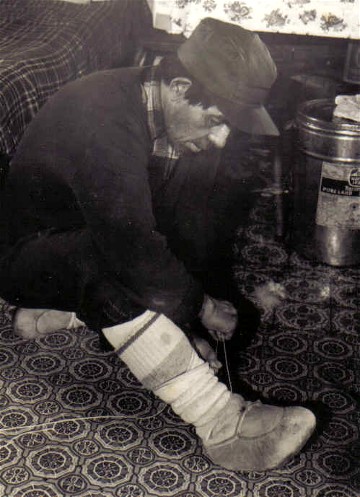 Warm and light , moccasins of moose or caribou skin are the standard footgear in the winter bush camps of all the northern Indians; they are also the best footgear for use with snowshoes , allowing for a greater control of the snowshoe than is possible with stiffer, more modern foot coverings ; Assinica Lake, Quebec 1980 ; from '' Making the Attikamek snowshoe '', photo Henri Vaillancourt