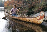 18 foot Fur-Trade style birch bark canoe  with typical painted  decoration and fancy root sewng on bows . This type  of bark canoe was built from the 1600's to the early 1900's  by both Indian and French craftsmen for Canadian government and military purposes ,as well as  for the fur-trade