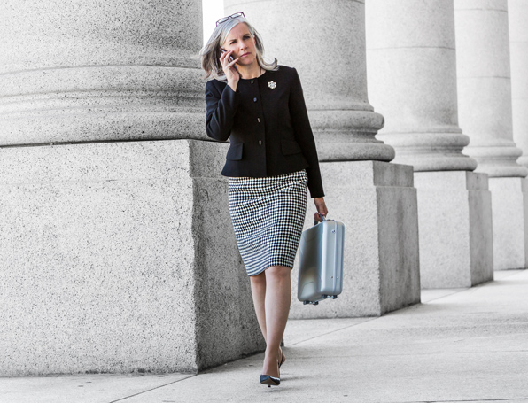 Woman walking while talking on her phone