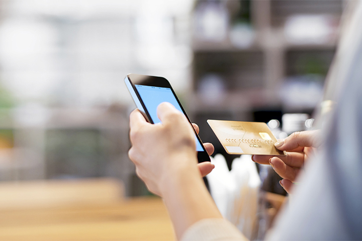 Customer inputting their credit card details into their smartphone