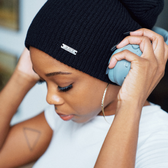 Woman listening to music on headphones