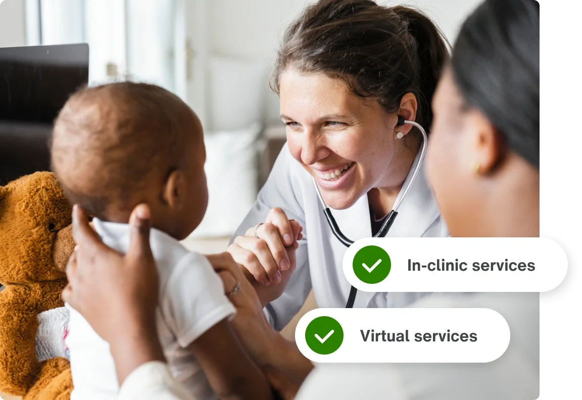 a mother supporting her baby while a doctor completes an infant exam at a TELUS Health Care Centre clinic