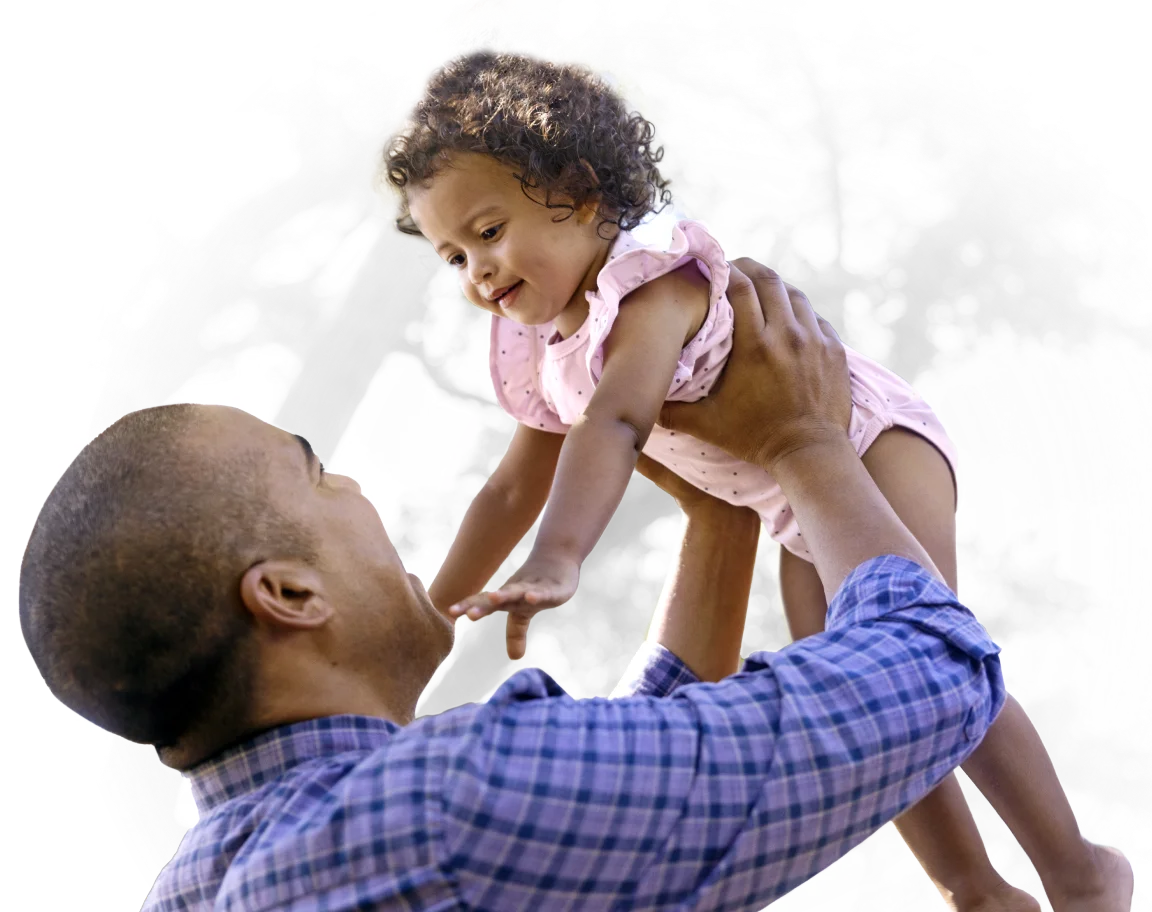 A man holding a child above his head