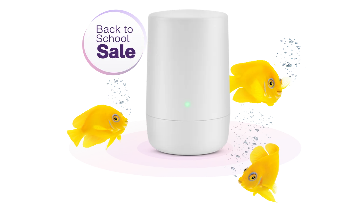 A school of fish swimming around a TELUS Wi-Fi hub. A roundel next to the image reads: Back to school sale.