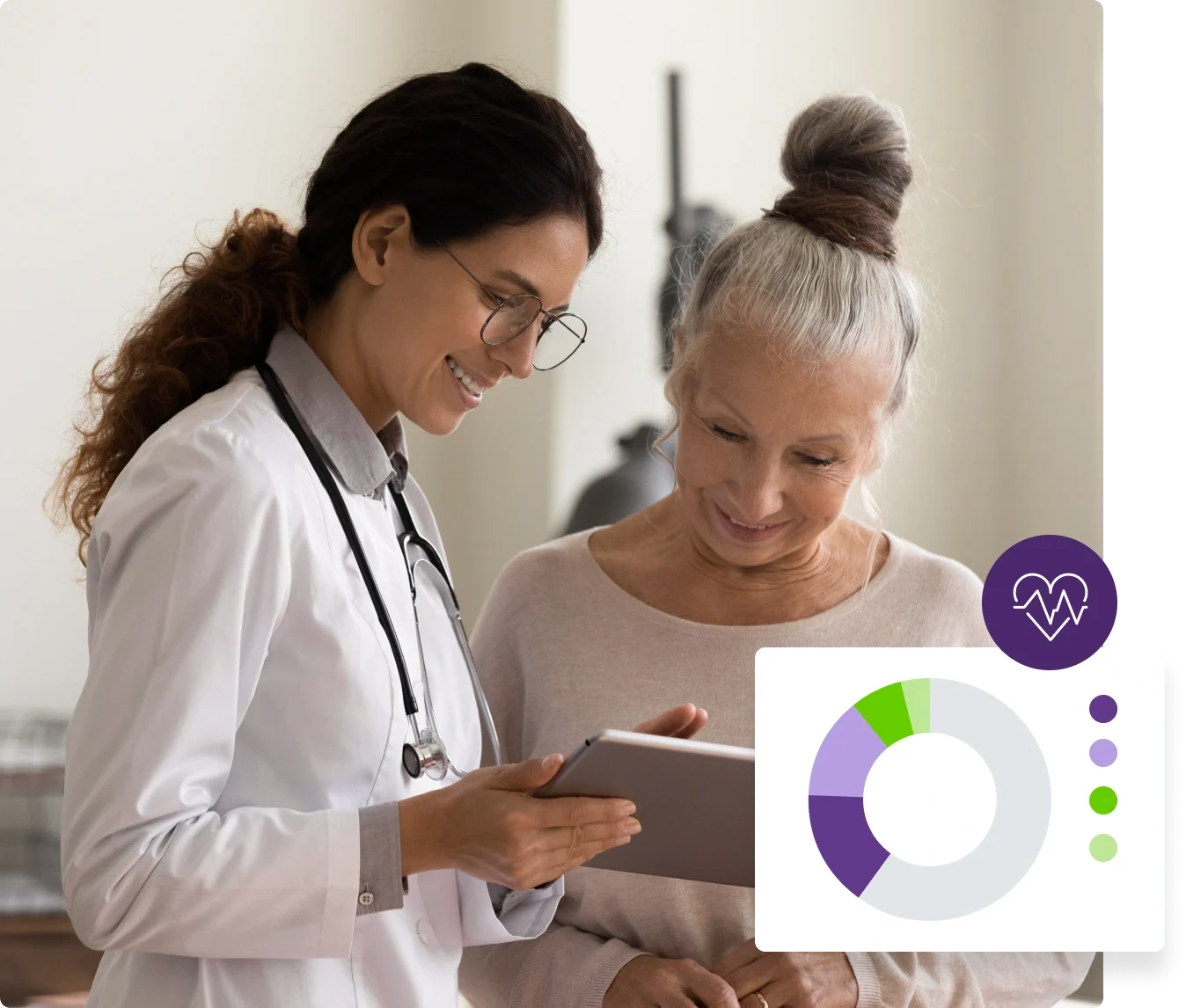 a healthcare practitioner and her patient looking at a tablet together