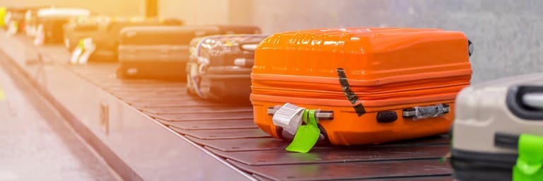 Baggage at the airport luggage conveyor belt