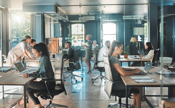 Corporate business people working in busy marketing office space, planning strategy in books and reading email on laptop at work. Businessman, businesswoman and workers at startup advertising company