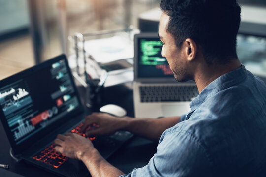 Man, typing and programmer on laptop in office workplace for data, analysis or statistics. IT, computer and male coder, engineer or person programming, coding and software development for information