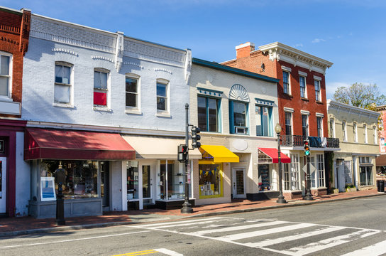 Traditional Old American Buildings with Colourful Shops along a Brick Sidewalk on a Clear Autumn Day