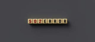 502 bad gateway error spelt out in wooden blocks on a grey background to answer what is 502 bad gateway