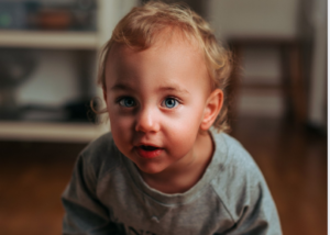 a kid with blue eyes