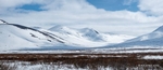 Photograph of snowcovered mountains from the Taylor Highway near Nome Alaska
