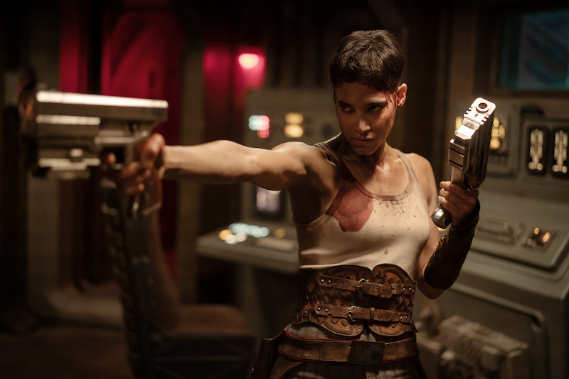 Sofia Boutella as Kora pointing a gun in Rebel Moon 2.