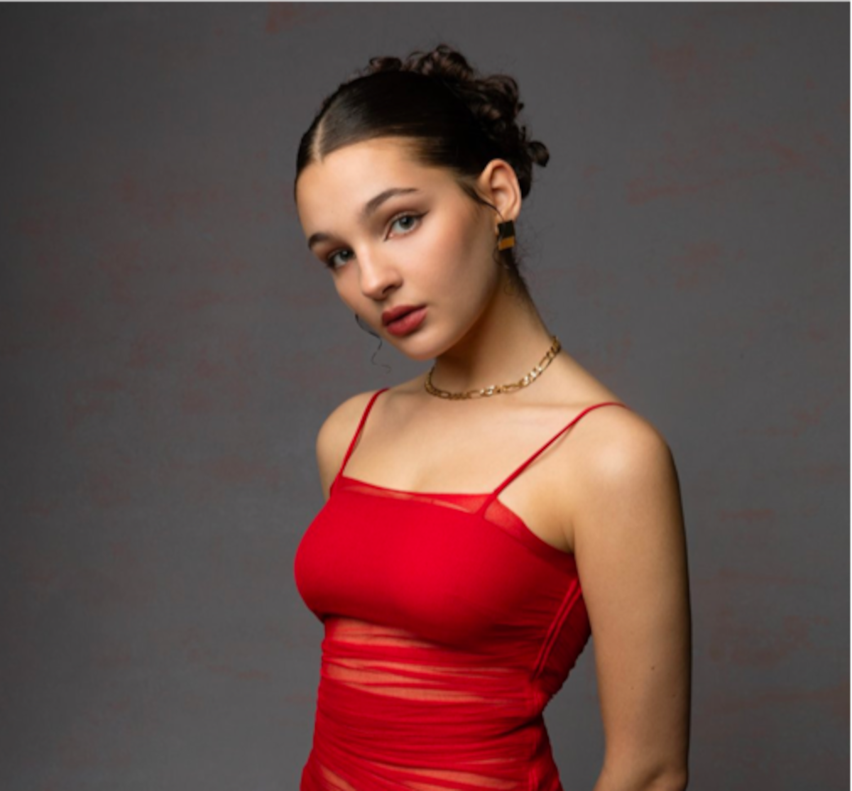 Headshot of Billie Boullet wearing a red dress