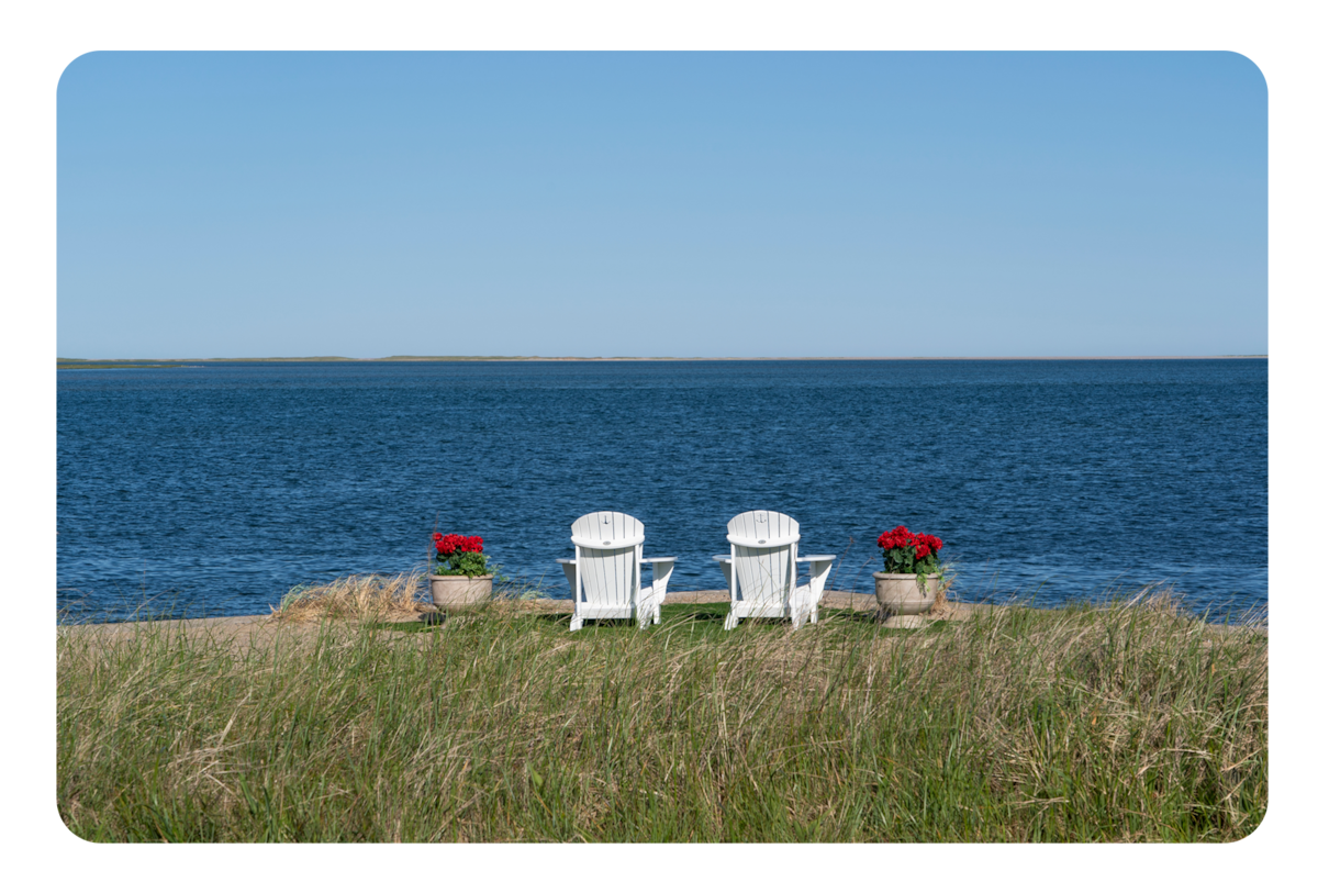 Two beach chair looking out toward the water in The Perfect Couple.